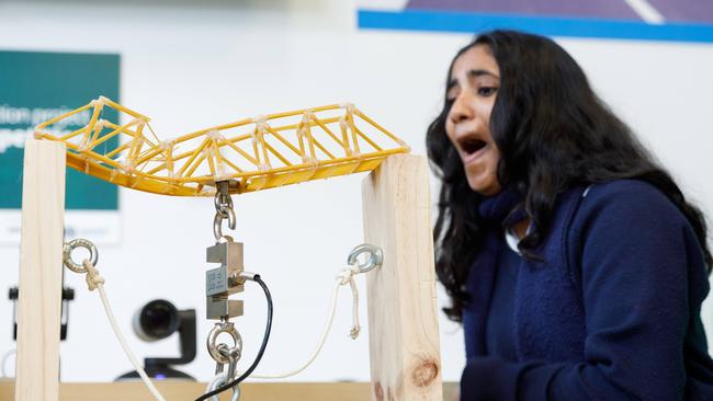 Maskil Jiiu from Burwood Girls High School reacts after her bridge collapsed under load. Picture by Max Mason-Hubers