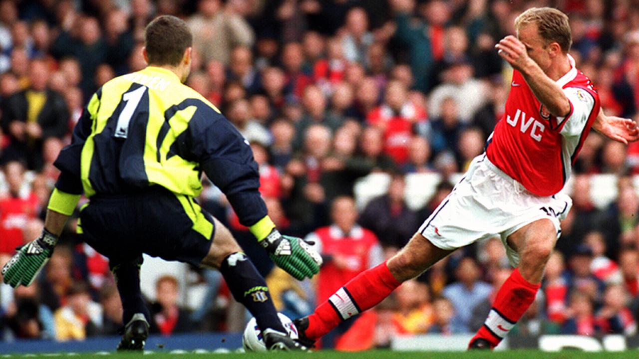 Arsenal gun Dennis Bergkamp in action.