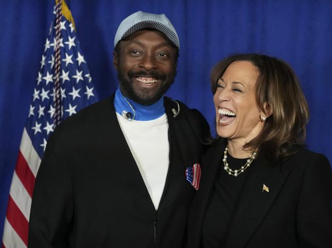 Kamala Harris poses with will.i.am at a campaign in Philadelphia the day before the election. Picture: AP