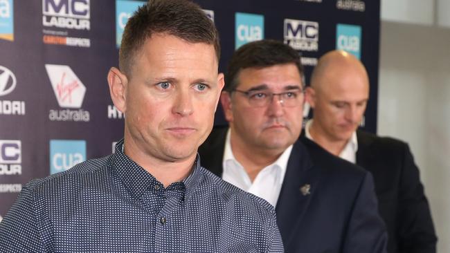 Brendon Bolton, followed by Carlton president Mark LoGiudice and chief executive Cain Liddle, leaves his press conference after he was sacked as coach. Picture: Michael Klein