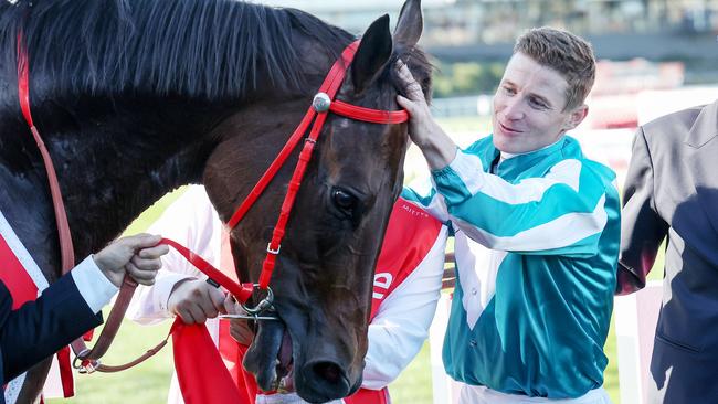 James McDonald gives Romantic Warrior a pat after the pair won the Cox Plate in October. Picture: George Sal/Racing Photos via Getty Images