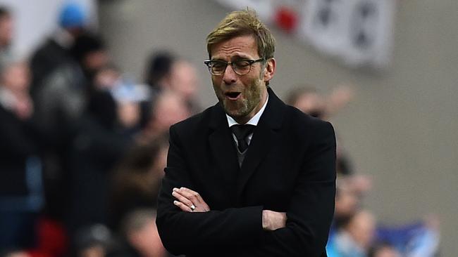 Liverpool's German manager Jurgen Klopp gestures on the touchline during the English League Cup final football match between Liverpool and Manchester City at Wembley Stadium in London on February 28, 2016. / AFP / Ben STANSALL / RESTRICTED TO EDITORIAL USE. No use with unauthorized audio, video, data, fixture lists, club/league logos or 'live' services. Online in-match use limited to 75 images, no video emulation. No use in betting, games or single club/league/player publications. /