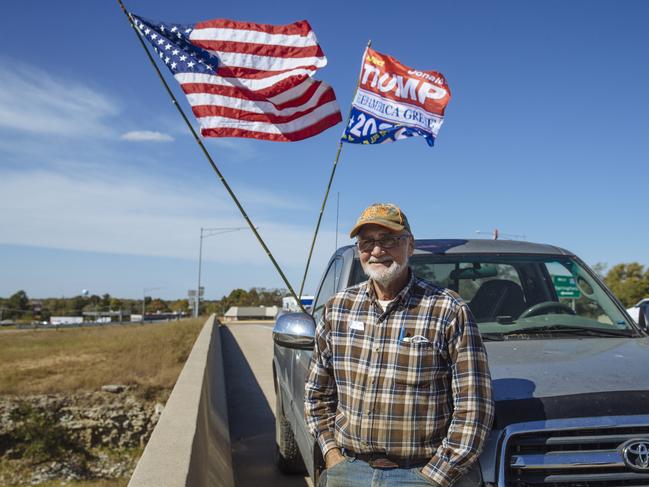 Howard Fuller, 70, spends two hours a day on a highway overpass in Lebanon, Missouri, encouraging people to vote for Trump. Picture: Angus Mordant for News Corp Australia