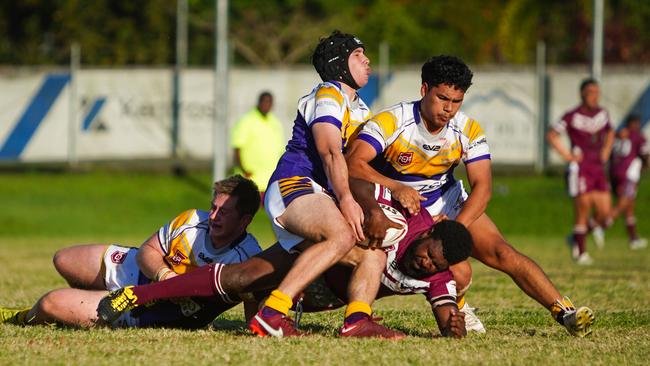 Edmonton duo Lachlan Rayson and Tyrell Anton tackle Yarrabah's Samukie Gaidan. Picture: Nuno Avendano