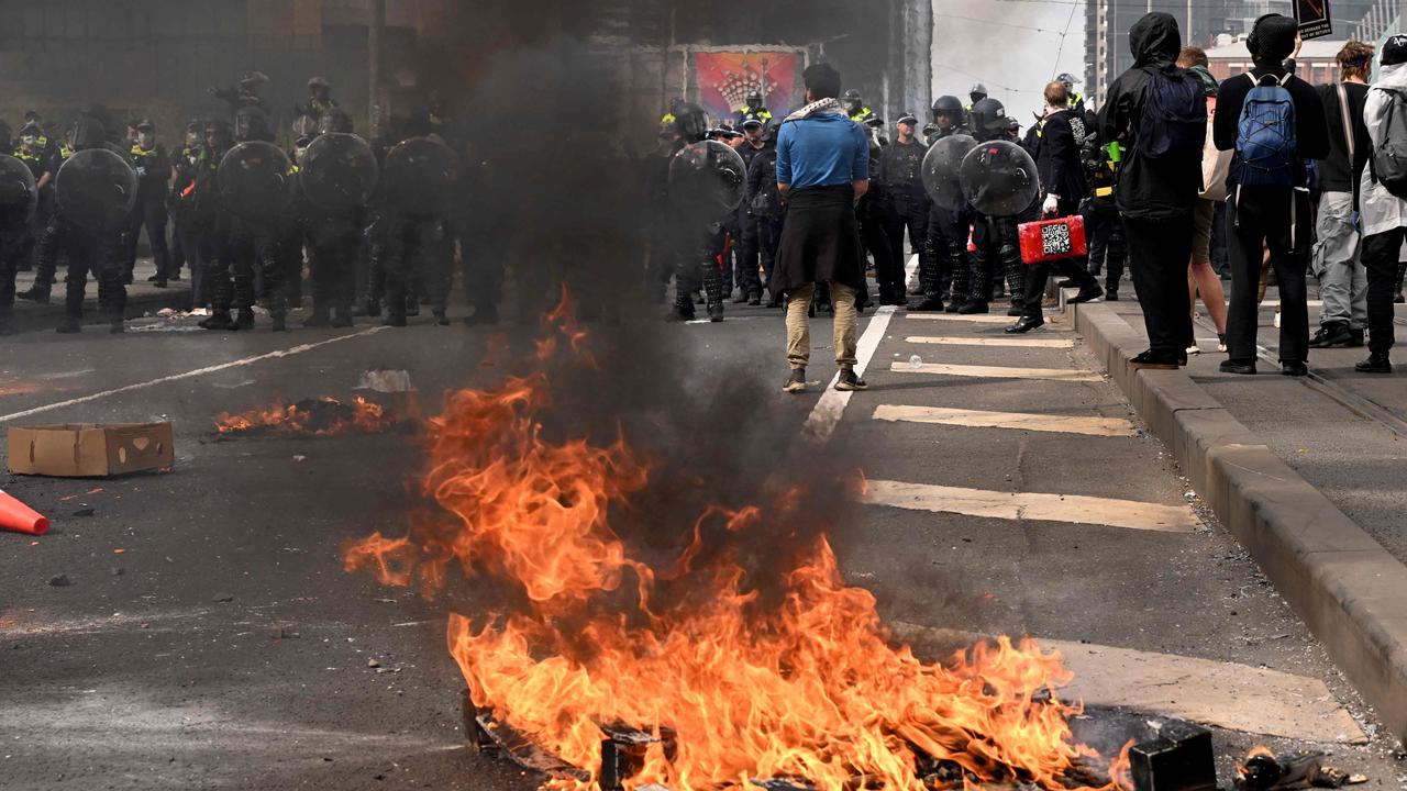 Protesters lit fires during the chaos. Picture: William West/AFP