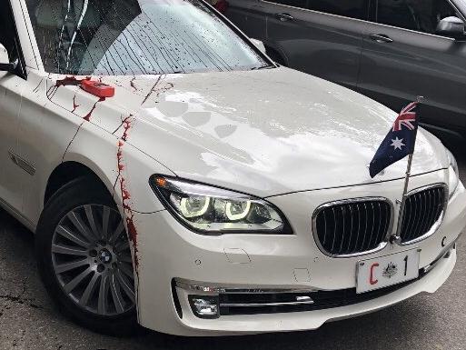 Refugee protesters have thrown red paint on Prime Minister Scott Morrison's car during his visit to the University of Queensland, October 12, 2020. Picture: Twitter via NCA NewsWireSource: https://twitter.com/RSMeanjin/status/1315443573521702914/photo/1