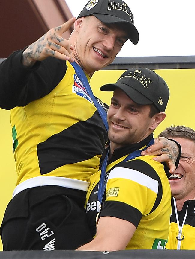 Cotchin pretends to throw Martin off a stage