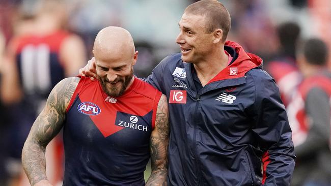 Simon Goodwin chats with Nathan Jones after Melbourne’s victory. Picture: Michael Dodge/Getty Images.