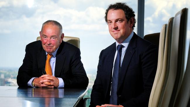 Veteran stockbroker Hugh Robertson Snr and son Hugh at their office in Melbourne. Picture: Luis Enrique Ascui