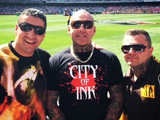 Kazem Hamad (left) at the footy with Toby Mitchell and senior Mongol bikie Tyrone Bell. Picture: Instagram