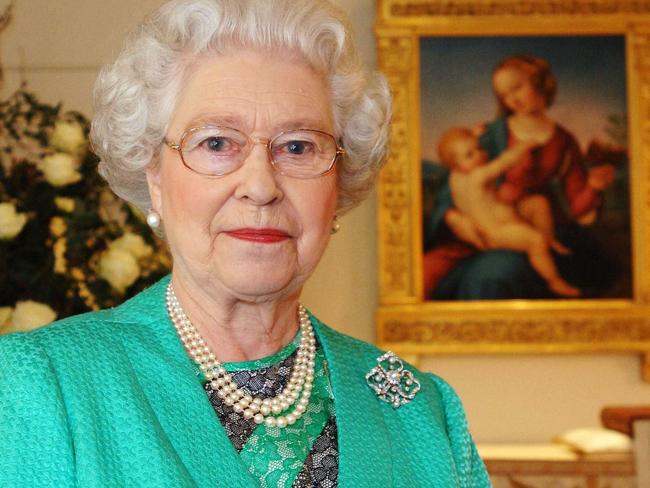 LONDON - DECEMBER 25: Queen Elizabeth II gives her Christmas speech to the nation in the Chapel at Buckingham Palace where she recorded her Christmas broadcast to the Commonwealth on December 25, 2005 in London, England. She praises the generous humanitarian response and compassion shown to those who suffered from the succession of natural disasters and acts of terrorism during the year. (Photo by Anwar Hussein/Getty Images)