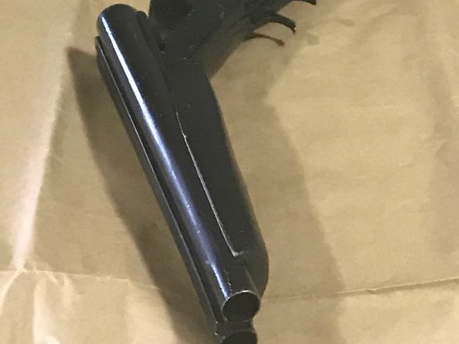 One of the sawn-off shotguns seized in the raid.