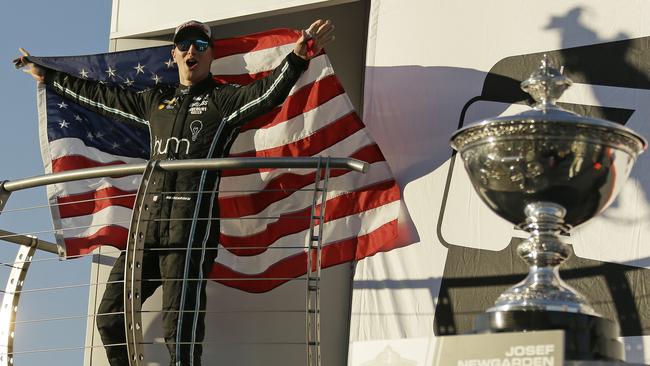 Josef Newgarden celebrates after winning the IndyCar championship.