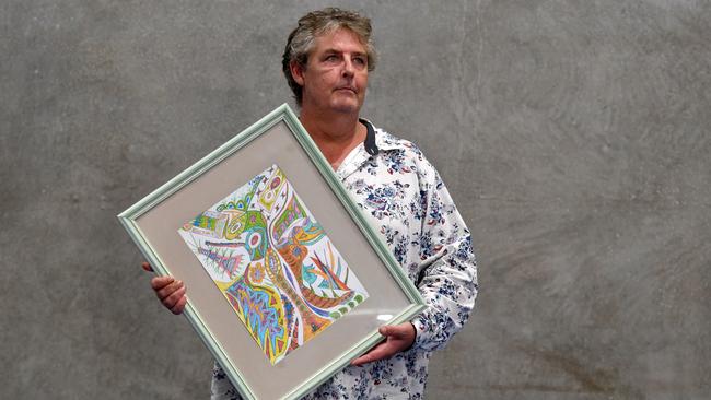 Artist Shane Dale with one of his artworks. Picture: Evan Morgan