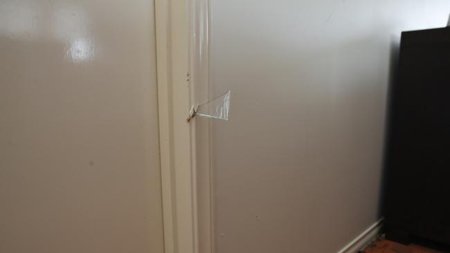 Glass lodged in a doorframe. Picture: Peter Ristevski