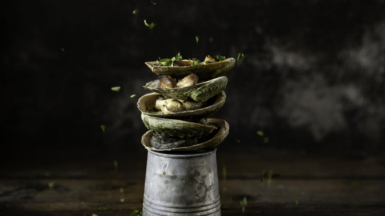 Analiese Gregory, baby abalone, shiitake and black garlic, grilled over fire. Winter Feast stallholder 2025. Picture: Dearna Bond/Dark Mofo