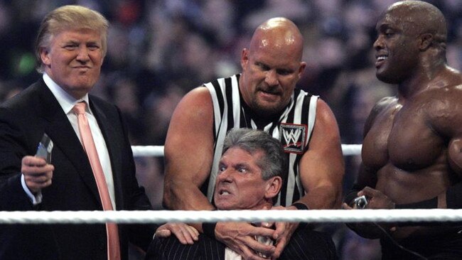 Donald Trump (left) has been employing tricks out of the WWE’s playbook, like the time he was involved at WrestleMania in 2007. Picture: Carlos Osorio/AP