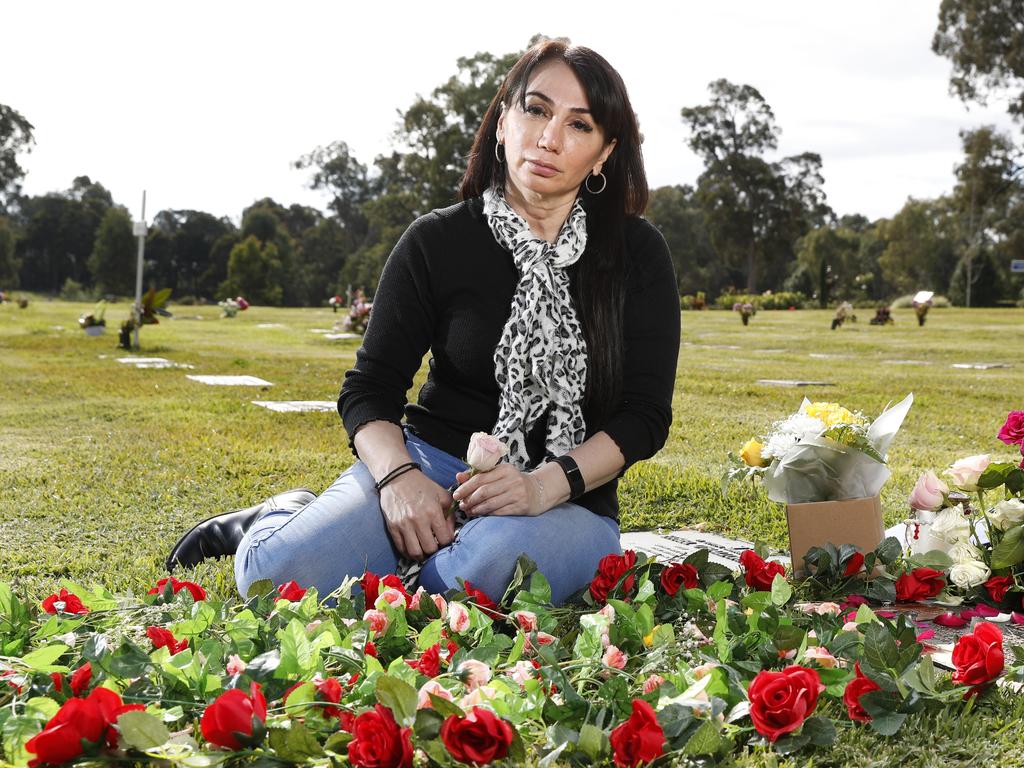 Tanya Petrus at the graveside memorial at Kemps Creek Cemetery for her daughter Merna Aprem who drowned in the bath at a care facility. Picture: Jonathan Ng