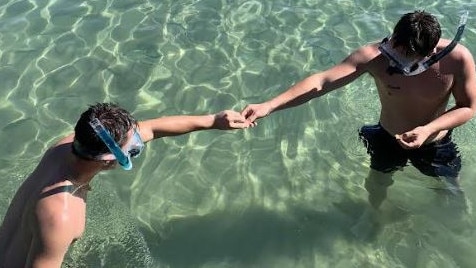 Zac Rourke (left) shares a moment with twin brother Max.