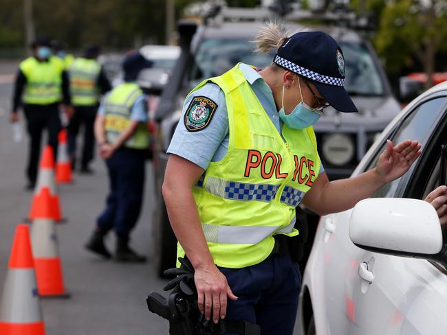 ALBURY, AUSTRALIA - NOVEMBER 22: NSW police are seen patrolling the Victorian border checkpoint in South Albury prior to its reopening on November 22, 2020 in Albury, Australia. New South Wales will reopen its border to Victoria at 12:01 on Monday 23 November, with people able to freely travel into NSW for the first time since border restrictions were put in place in July due to Victoria's second wave COVID-19 outbreak. (Photo by Lisa Maree Williams/Getty Images)