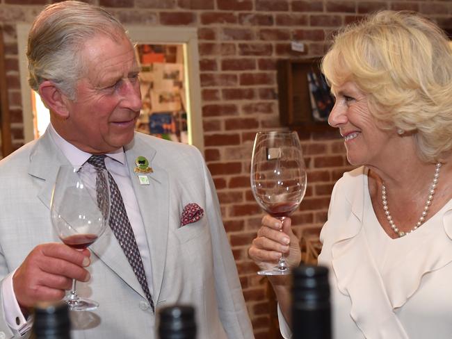 Britain's Prince Charles and his wife, Camilla the Duchess of Cornwall (right) try local wines during a visit Oranje Tractor Wines in Albany, Saturday, Nov. 14, 2015. The Prince of Wales and Duchess of Cornwall have kicked off the final leg of their tour of Australia and New Zealand with a flying visit to Albany. (AAP Image/Tracey Nearmy) NO ARCHIVING