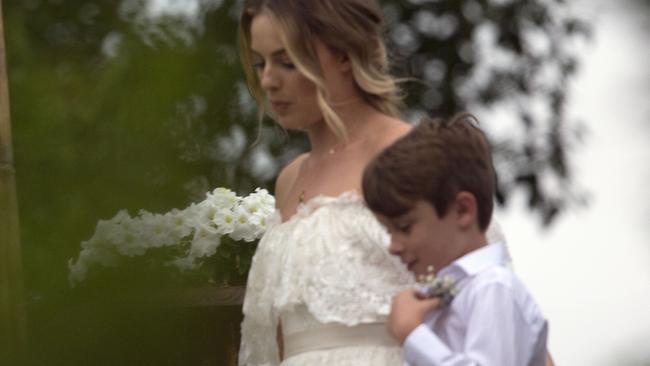 Margot was accompanied by her nephew at the low-key wedding.