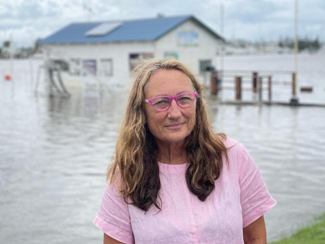 Clarence Valley councillor Debrah Novak stands in front of the submerged Yamba Oyster Shack.