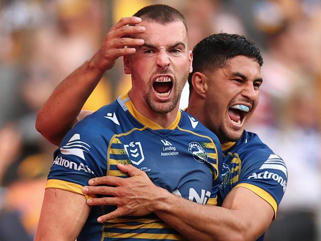 SYDNEY, AUSTRALIA - APRIL 18: Clinton Gutherson of the Eels celebrates scoring a try with team mate Dylan Brown of the Eels during the round six NRL match between the Parramatta Eels and the Wests Tigers at CommBank Stadium on April 18, 2022, in Sydney, Australia. (Photo by Cameron Spencer/Getty Images) *** BESTPIX ***