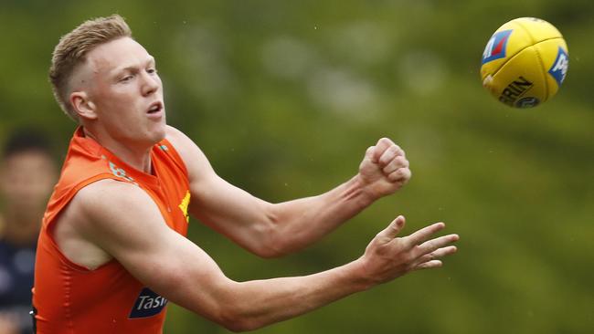 James Sicily fires out a handpass at Waverly Park on Friday. Picture: Daniel Pockett/AFL Photos