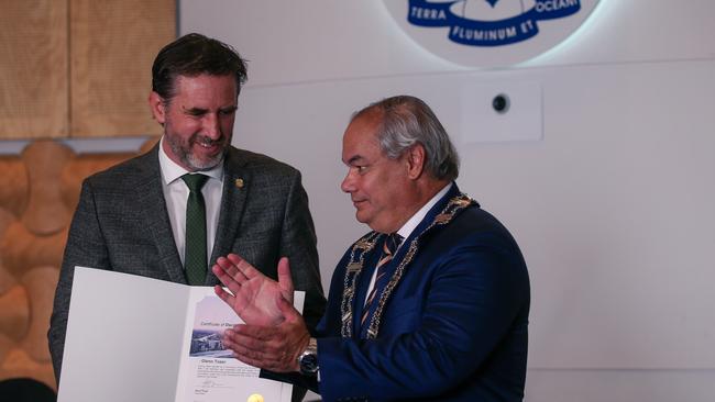 Cr Glenn Tozer with Mayor Tom Tate as the new Gold Coast City Council is sworn in at Council Chambers in Bundall. Picture: Glenn Campbell