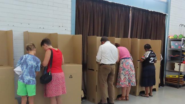 Incumbent Solomon MP Luke Gosling casts his vote at Ludmilla Primary School in Darwin, alongside wife Kate at the 2025 federal election. Picture: Fia Walsh.