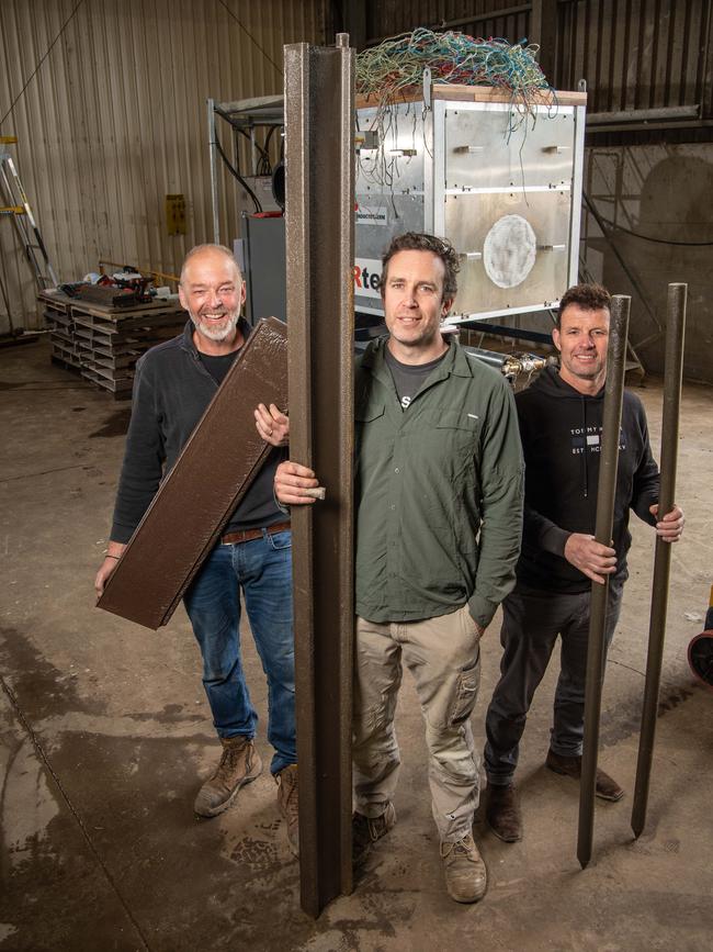 Inventor William Ritchie (middle) with Adrian Probert and Shane Middleton with some of the plastic products made with the world-first technology. Picture: Brad Fleet