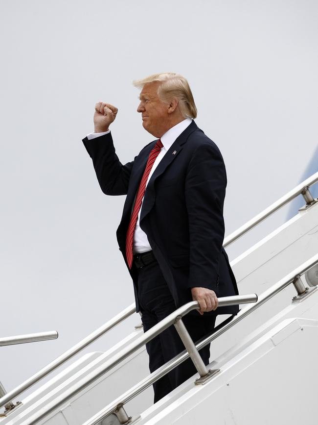 President Donald Trump gestures as he steps off Air Force One to tour a renewable energy facility in Council Bluffs, Iowa. Picture: AP