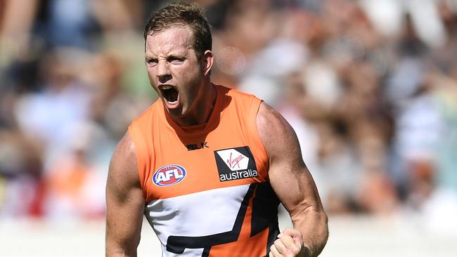 CANBERRA, AUSTRALIAN CAPITAL TERRITORY - APRIL 03: Steve Johnson of the Giants celebrates kicking a goal during the round two AFL match between the Greater Western Sydney Giants and the Geelong Cats at Star Track Oval on April 3, 2016 in Canberra, Australia. (Photo by Brett Hemmings/AFL Media/Getty Images)