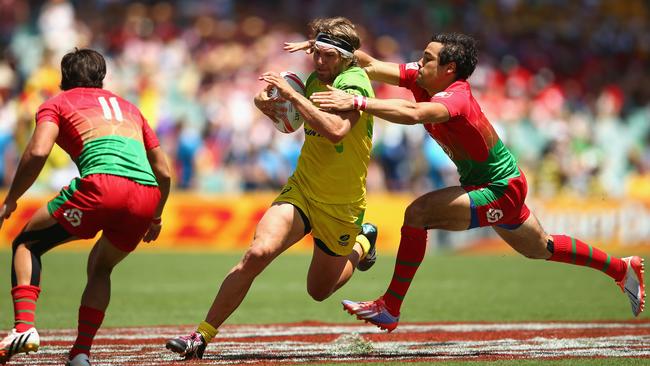 SYDNEY, AUSTRALIA - FEBRUARY 06: Lewis Holland of Australia runs the ball during the 20146 Sydney Sevens match between Australia and Portugal at Allianz Stadium on February 6, 2016 in Sydney, Australia. (Photo by Mark Kolbe/Getty Images)