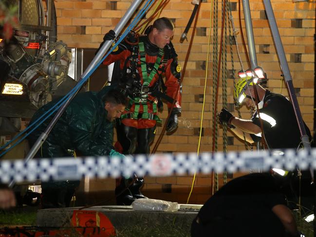 Emergency services at the site where a man’s body was discovered in a sewage tank. Picture: AAP/image David Clark