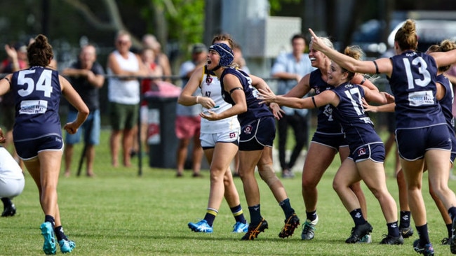 Lauren James (in the helmet) celebrates after kicking the winning goal against Bond University. Pic: Jessy Hart