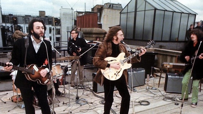 The Beatles’ famous London rooftop concert in 1969, bemusing ‘City types’ in bowler hats in the street below.