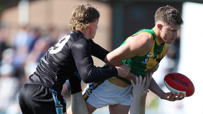 Leongatha’s Aaron Heppell tries to get past a Wonthaggi player during last year’s grand final. Both sides have locked in matches this pre-season. Picture Yuri Kouzmin