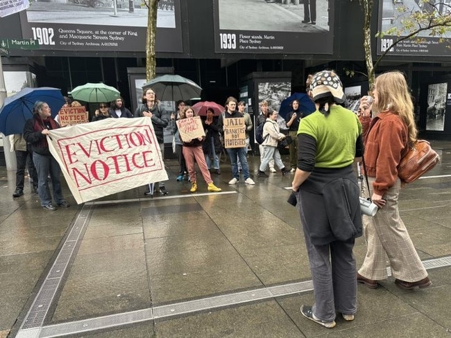 A group of protesters have gathered outside the RBA ahead of today's rate announcement.