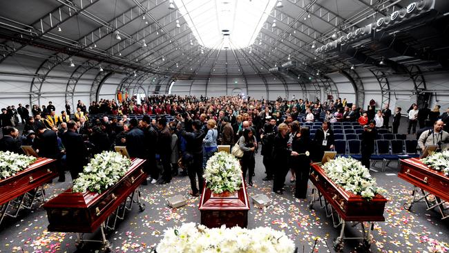 Caskets stand next to each other during the Lin family funeral at Olympic park in Sydney on August 8 2009. Picture: AAP Image/Tracey Nearmy