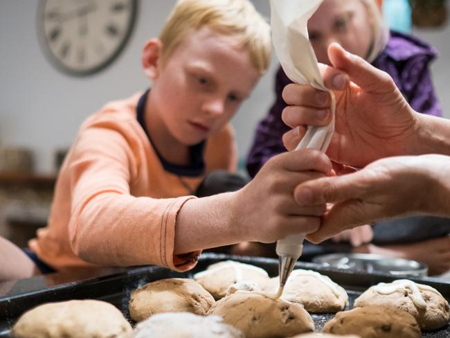 Use a wooden spoon to stir until combined then use your hands to bring the dough together in the bowl.