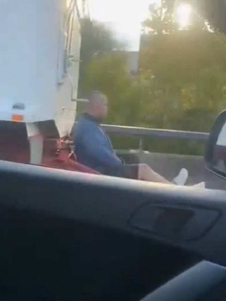 Monash Freeway Video Captures Man Sitting On A Trucks Axle As It Drives Down A Freeway 2513