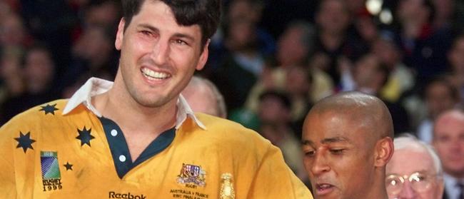 John Eales and Australian scrum-half George Gregan.     (Photo by William WEST / AFP)