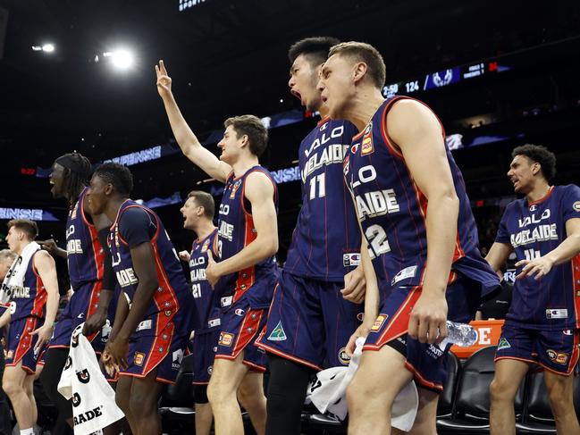 PHOENIX, ARIZONA - OCTOBER 02: Cameron Thew #13, Kyrin Galloway #14, Kai Sotto #11 and Hyrum Harris #22 of the Adelaide 36ers react after a basket during the second half against the Phoenix Suns at Footprint Center on October 02, 2022 in Phoenix, Arizona. The 36ers beat the Suns 134-124. NOTE TO USER: User expressly acknowledges and agrees that, by downloading and or using this photograph, User is consenting to the terms and conditions of the Getty Images License Agreement. (Photo by Chris Coduto/Getty Images)