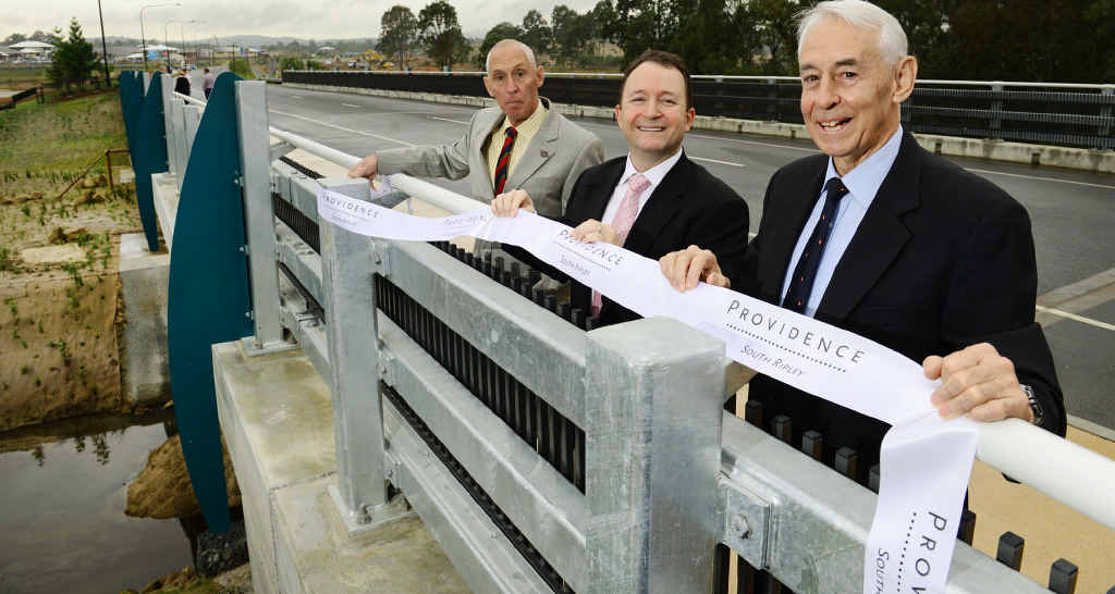 IPSWICH HISTORY: Great grandsons of James Ivory, Derek Nixon-Smith (right) and Rod Nixon-Smith (left) with developer Adam Shephard (centre) from Amex Corporation at the opening of the James Ivory Bridge in Providence, South Ripley. Picture: David Nielsen