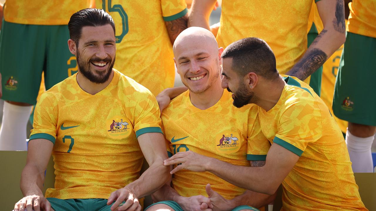 DOHA, QATAR – NOVEMBER 18: Mathew Leckie, Aaron Mooy and Aziz Behich of Australia are seen during the Australia Official Team Photo at Aspire Training Ground on November 18, 2022 in Doha, Qatar. (Photo by Robert Cianflone/Getty Images)