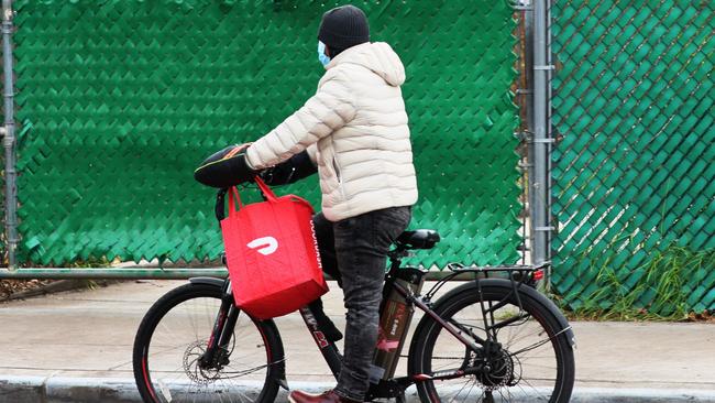 A DoorDash delivery rider. Some of its workers in the US wonder why it’s worth so much when, they say, they earn a minimal wage. Picture: AFP)