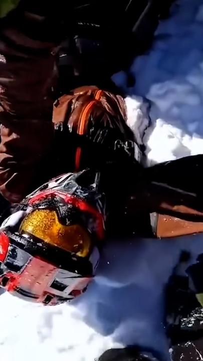 Man rescued after snowmobile plunges into hidden ravine