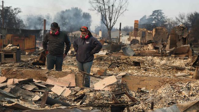 Khaled Fouad and Mimi Laine inspect a family member's property that was destroyed by Eaton Fire at Altadena, California. Pictures: Getty Images via AFP